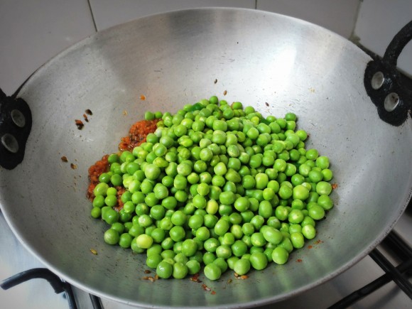 Add peas and chop green chili