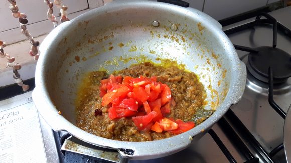 Add ground onion ,chopped tomato and ginger paste 