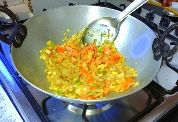 frying onion with tomato