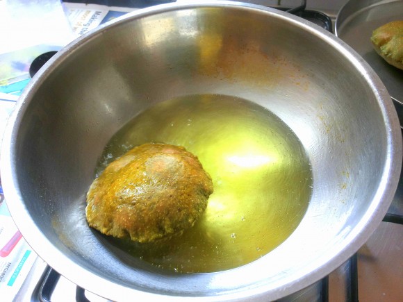 Deep frying the poori 