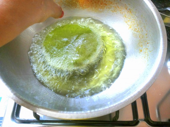 Deep frying the poori 