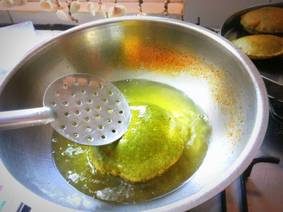 Deep frying the poori 