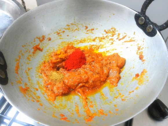 Add 1 teaspoon of red chili powder, coriander powder and turmeric powder