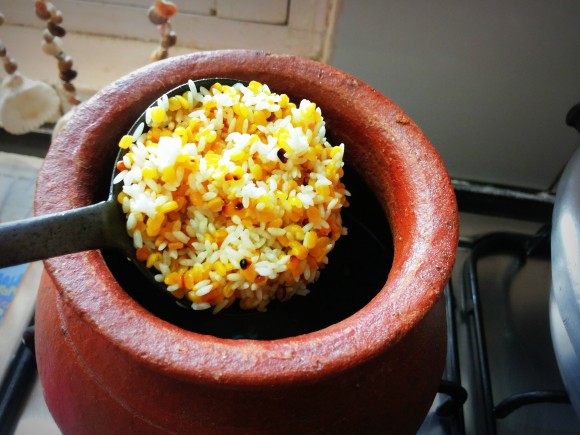 Clean and wash the roasted dal along with rice