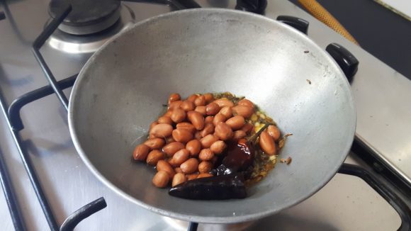 Add red chili and peanuts