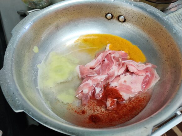 mutton slices, garlic paste, turmeric powder and chili powder 