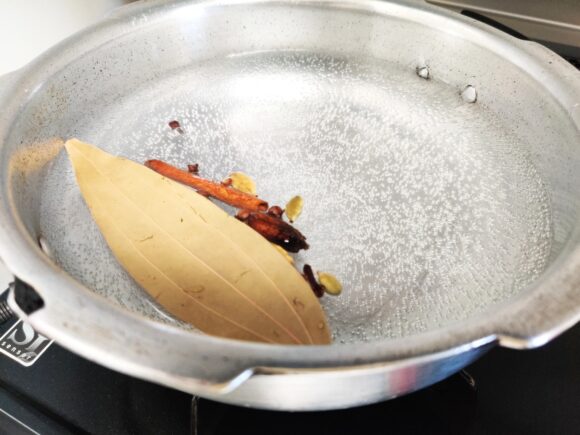 Boil water along with bay leaf, both the cardamom, cinnamon, mace and clove