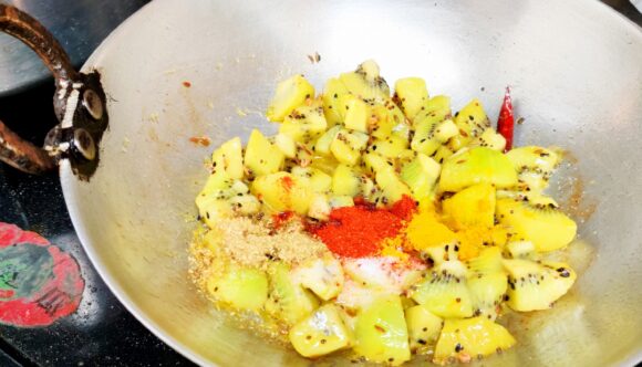 add turmeric powder chili powder, coriander powder and salt. 