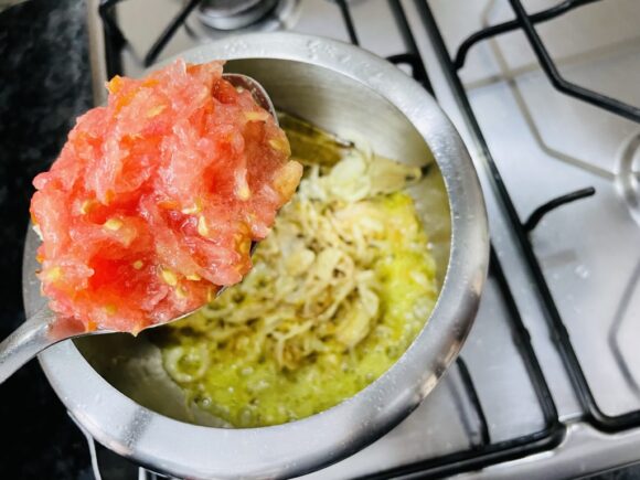 add grated tomato, chilli powder, turmeric powder, salt, cumin powder and coriander powder