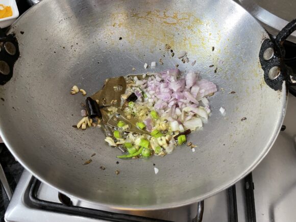 add chopped onion and green chilli,