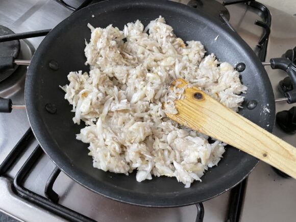 Heat ghee in a frypan, when ghee is heated, add grated Singhara