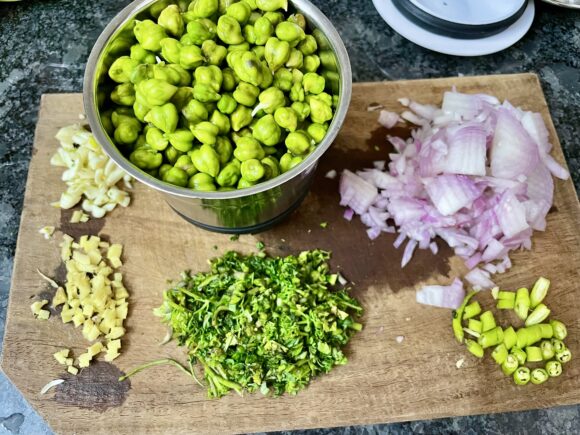 Chop green coriander leaf, onion, green chilli , ginger, garlic