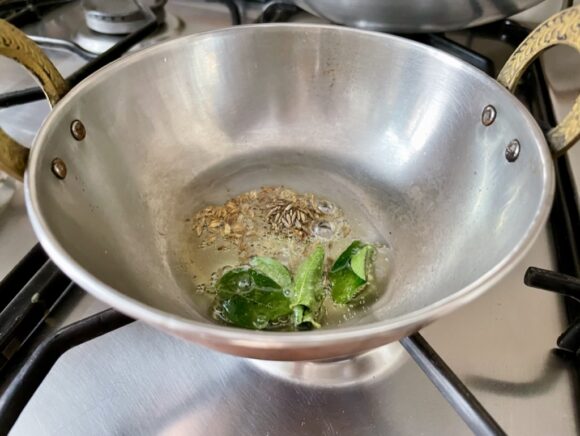 Heat ghee in a frypan, add cumin and curry leaves