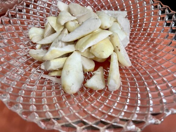 Peel out the Kachche Singhara (Fresh Water Chestnuts)