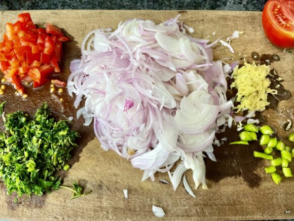 Chop onion, ginger, garlic, green chilli and tomato