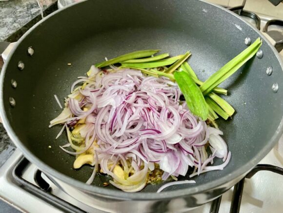 Add  other half chopped onion and Pandan Leaf