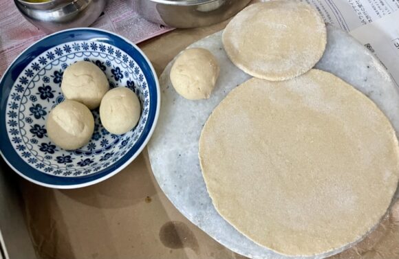 dust ball with Aatta and roll the chapati with equal pressure all around