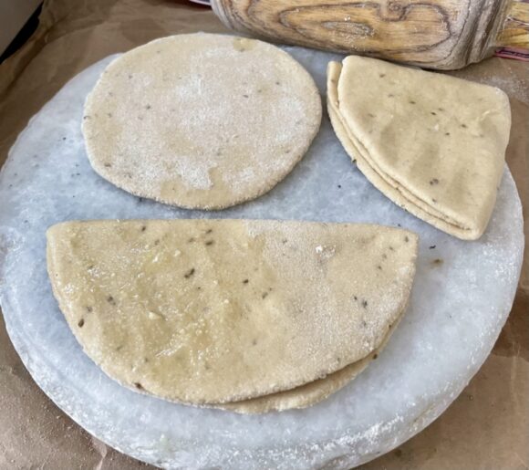 rolling the aloe vera paratha