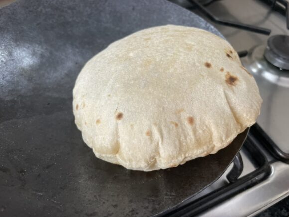 can puff chapati on tawa instead of flame, and press it lightly with kitchen towel