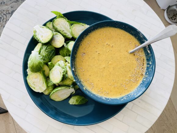 Trim the stalk of Brussels Sprouts, slice them longitudinally into two-three slices