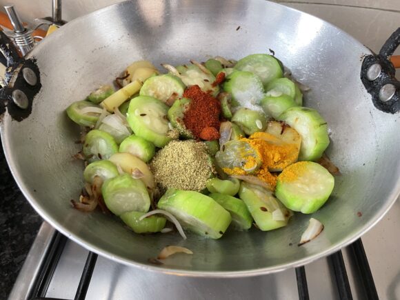 add Chilli Powder, Coriander powder, Turmeric Powder and Salt,