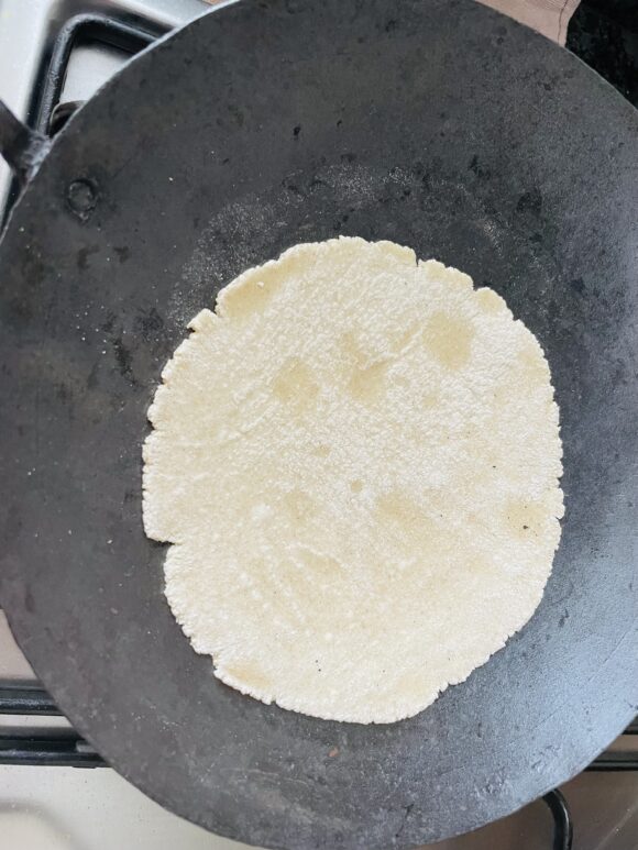 Flip the chapati and cook