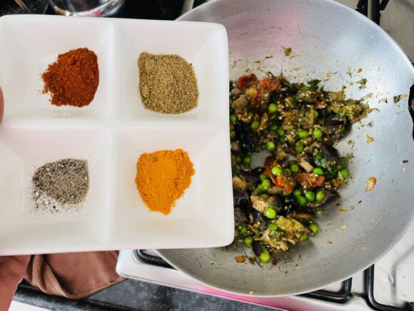 add turmeric powder, chilli powder, coriander powder, and salt.