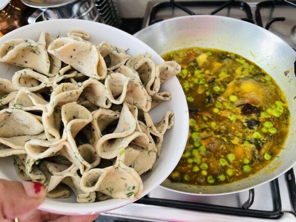 Add the prepared dhoklis to the boiling curry