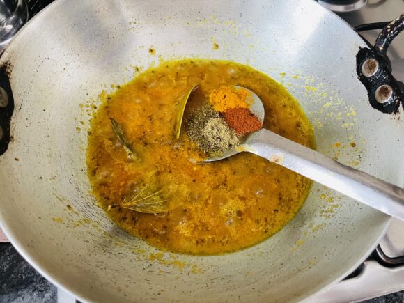 Add powder masala, turmeric, coriander, red chilli powder, and salt