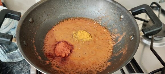 add chilli powder, coriander powder and turmeric powder and salt.