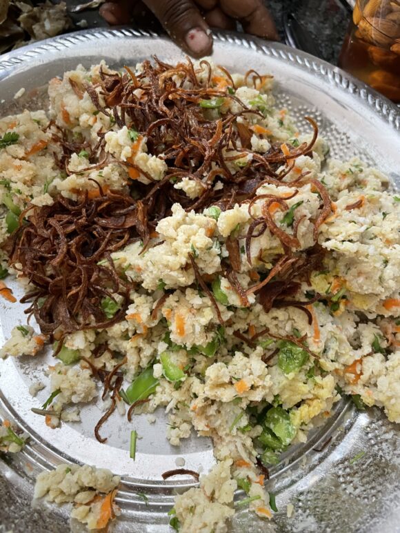 put soaked poha, chopped coriander, grated potato, carrot, chopped bell peppers, green chilli, ginger, fried onion, all powder masala, corn flour and salt.